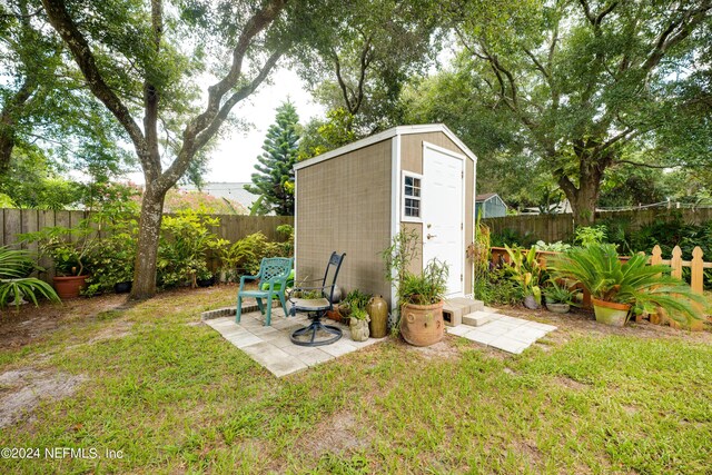 view of outbuilding featuring a yard