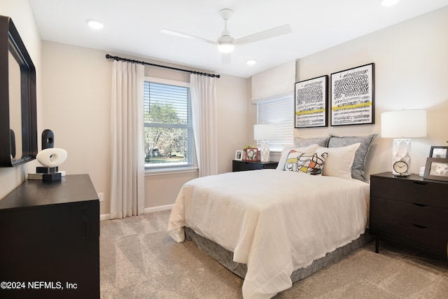 bedroom featuring ceiling fan and light carpet