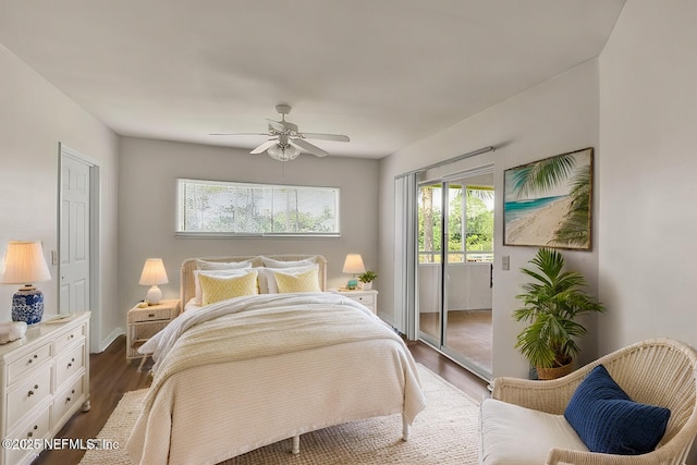 bedroom featuring dark hardwood / wood-style flooring, ceiling fan, and access to outside