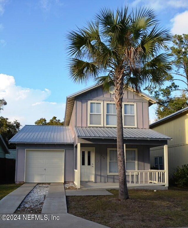 view of front of house featuring a garage and a porch