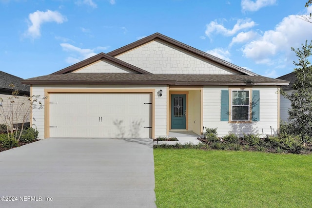 view of front facade featuring an attached garage, driveway, roof with shingles, and a front yard