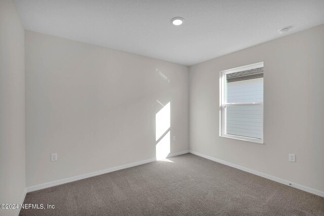 unfurnished room featuring carpet floors