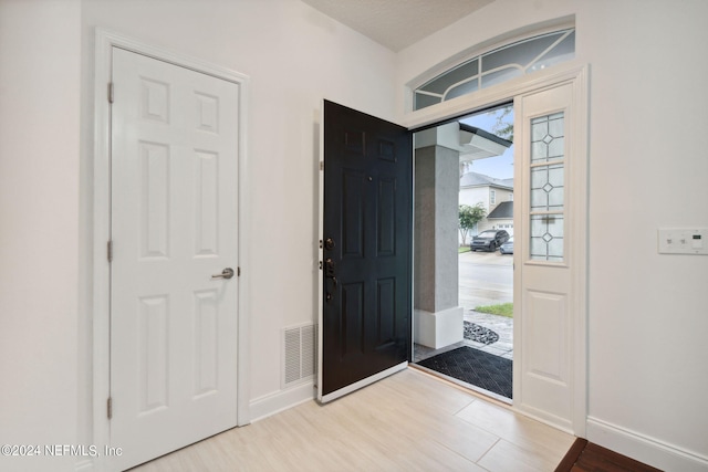 entrance foyer with light hardwood / wood-style flooring