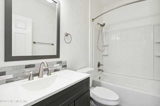 full bathroom featuring decorative backsplash, toilet, vanity, and shower / washtub combination