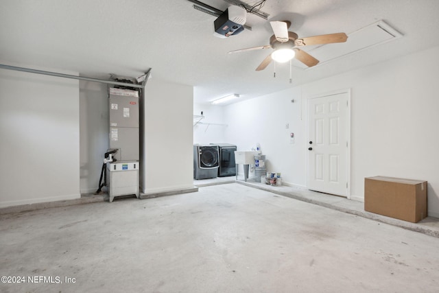 garage featuring ceiling fan, washer and dryer, a garage door opener, heating unit, and sink