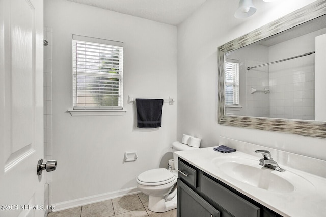 bathroom with vanity, tile patterned floors, and toilet