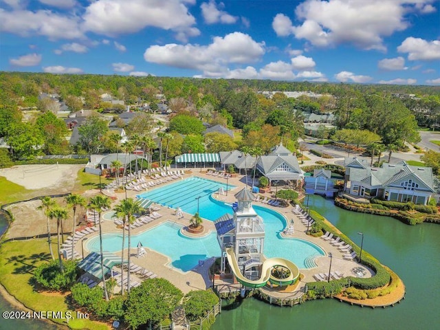 birds eye view of property with a water view