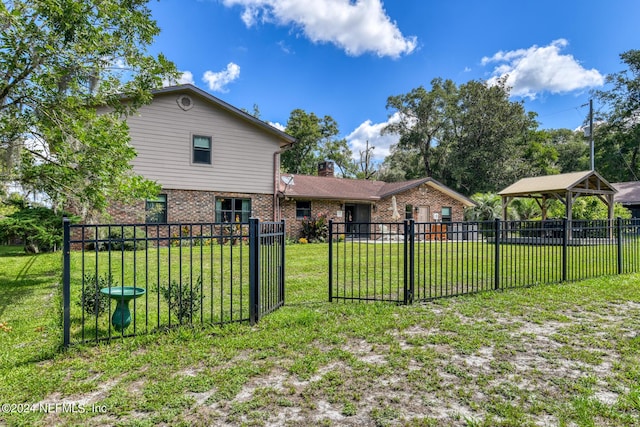 view of yard with a gazebo and fence