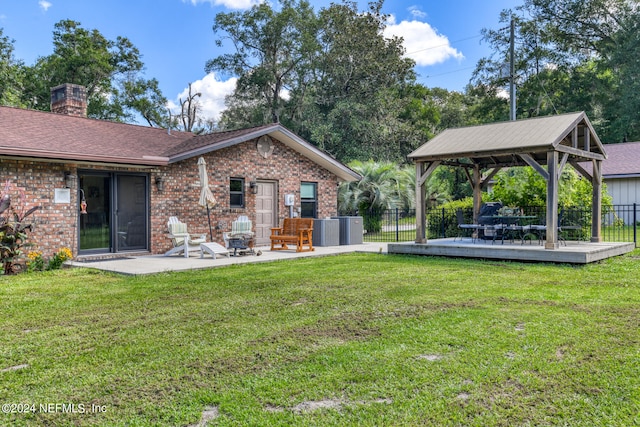 view of yard with a patio, a gazebo, and a wooden deck