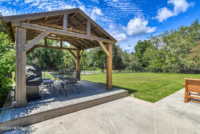 view of patio / terrace featuring outdoor dining area, a fenced backyard, and a gazebo