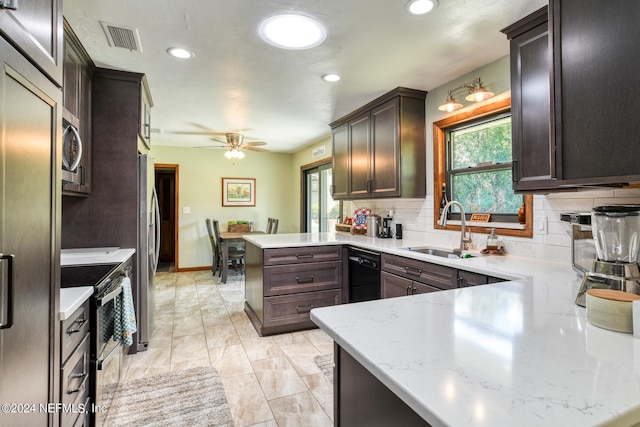 kitchen featuring appliances with stainless steel finishes, decorative backsplash, kitchen peninsula, and ceiling fan