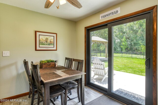 dining space featuring a wealth of natural light and ceiling fan