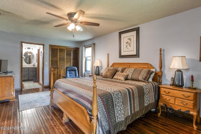 bedroom featuring a closet, ceiling fan, ensuite bathroom, a textured ceiling, and dark wood-type flooring