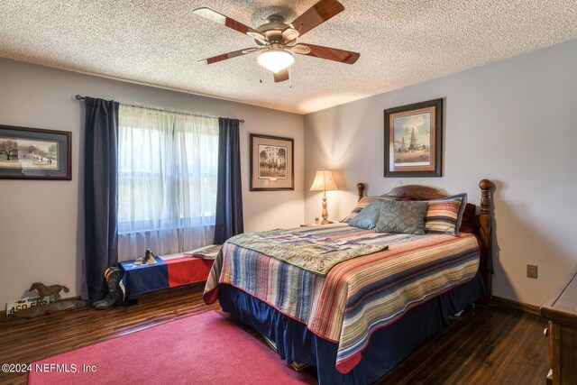 bedroom with a ceiling fan, a textured ceiling, baseboards, and wood finished floors