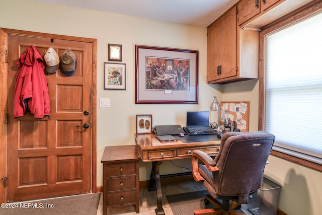 office area with light hardwood / wood-style floors