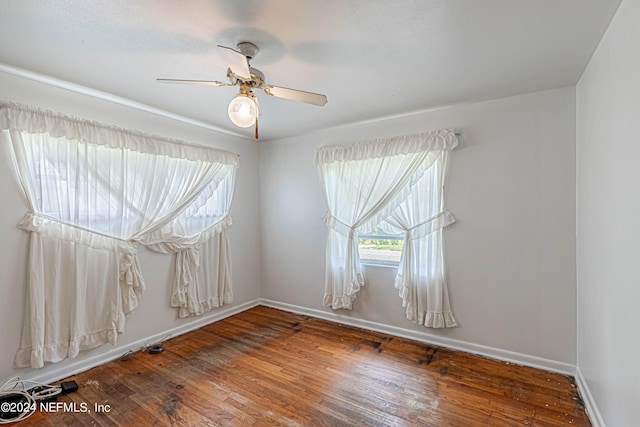 unfurnished room featuring wood-type flooring and ceiling fan