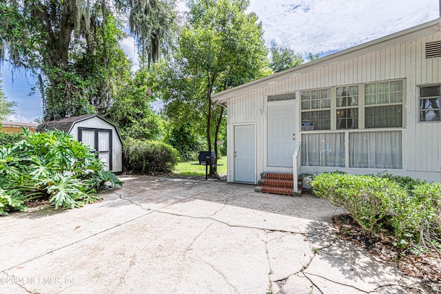 view of patio / terrace featuring a shed