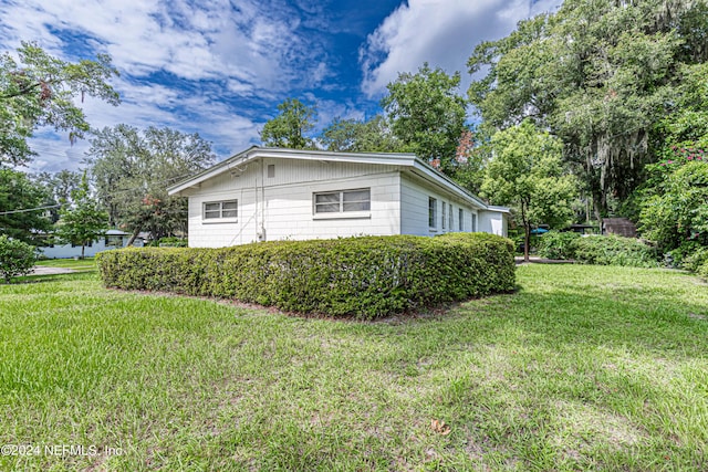 view of home's exterior featuring a lawn