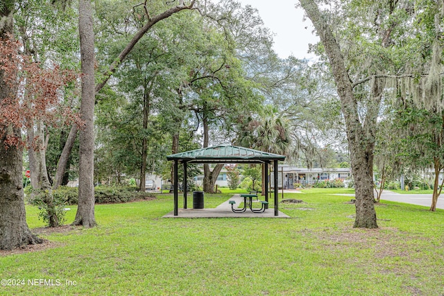 view of property's community featuring a gazebo and a lawn