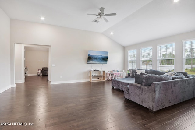 living room featuring dark hardwood / wood-style flooring, vaulted ceiling, and ceiling fan