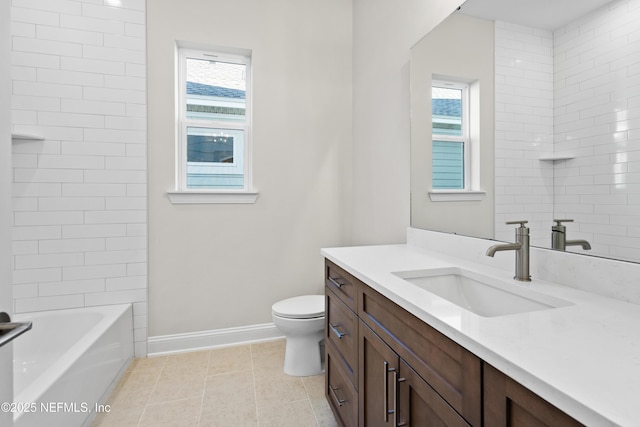 full bathroom featuring vanity, toilet, tiled shower / bath combo, and tile patterned flooring