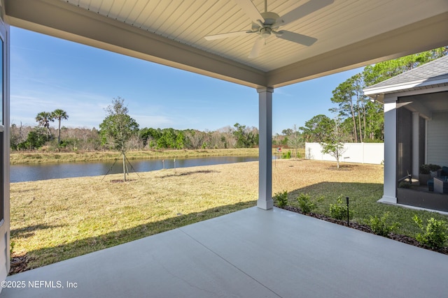 view of patio / terrace featuring ceiling fan and a water view