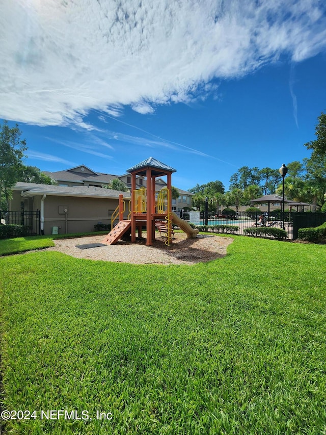 view of play area with a yard