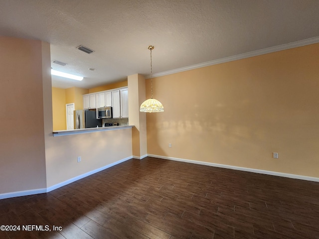 kitchen featuring decorative light fixtures, white cabinetry, kitchen peninsula, dark hardwood / wood-style flooring, and appliances with stainless steel finishes