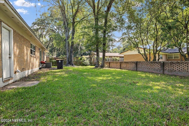 view of yard featuring central AC unit