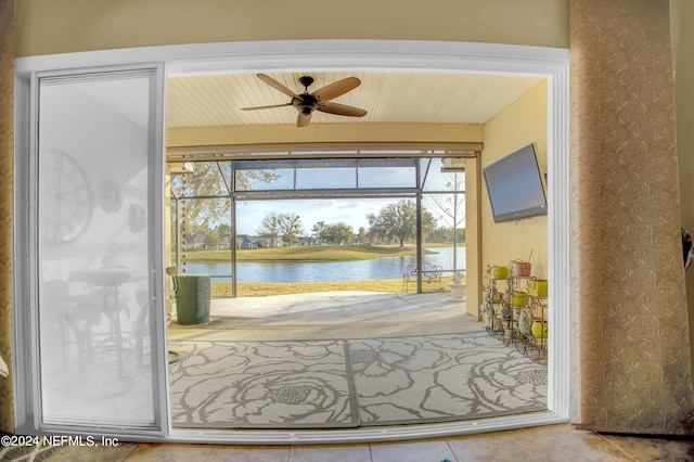 interior space with ceiling fan