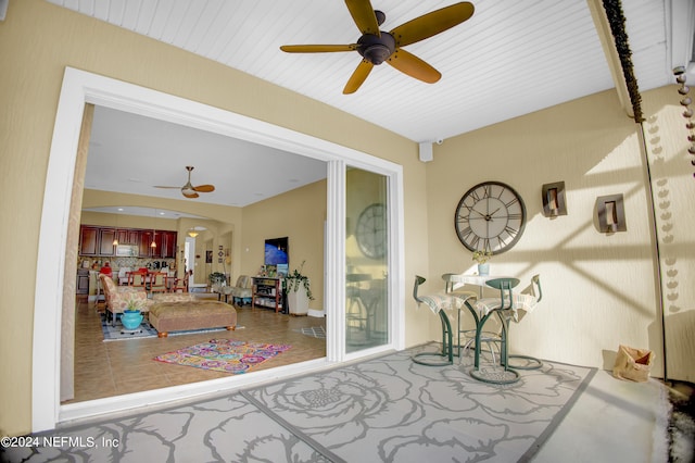 interior space featuring ceiling fan