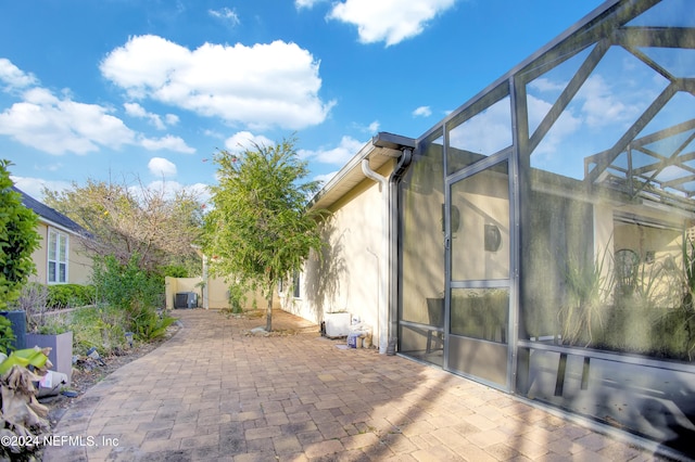 view of patio / terrace with glass enclosure