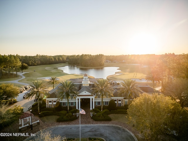 aerial view at dusk with a water view