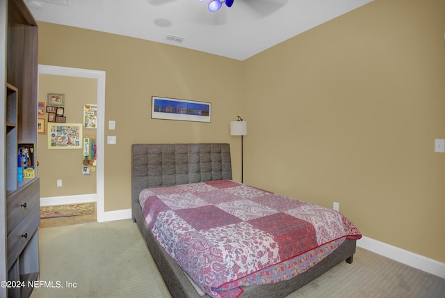 bedroom with light carpet and ceiling fan