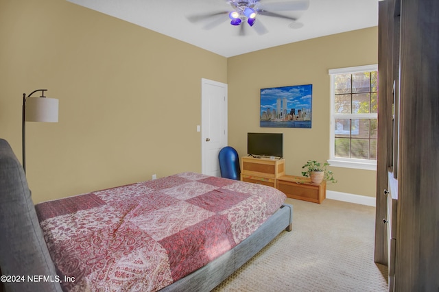 carpeted bedroom with ceiling fan