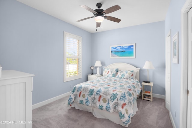 carpeted bedroom featuring ceiling fan