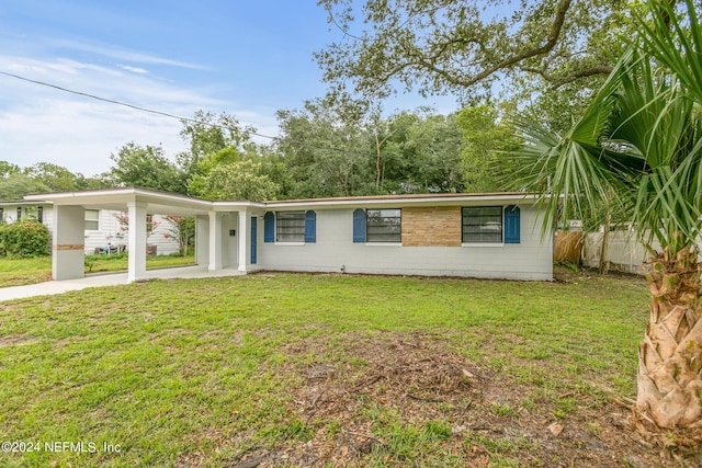 ranch-style house with a carport and a front yard