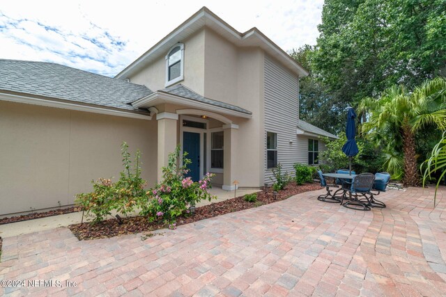 rear view of house with a patio area