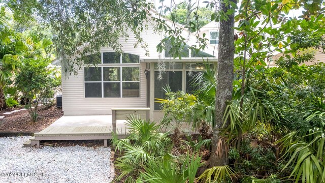 rear view of house with a sunroom