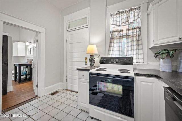 kitchen featuring electric range oven, dark countertops, white cabinetry, and dishwasher