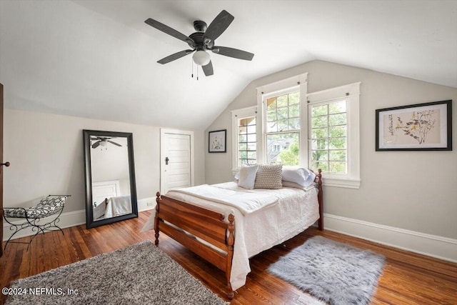 bedroom with lofted ceiling, wood finished floors, a ceiling fan, and baseboards