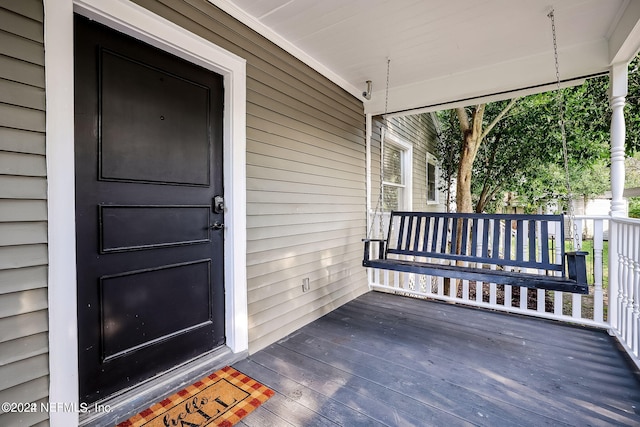 property entrance featuring covered porch