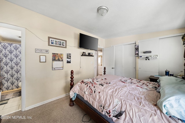 carpeted bedroom featuring multiple closets