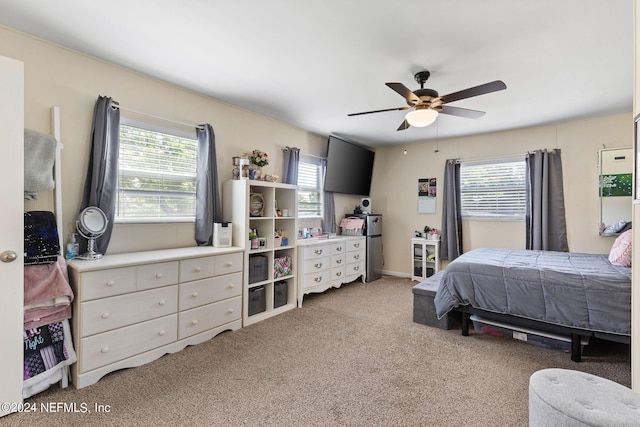 bedroom with carpet, multiple windows, and ceiling fan