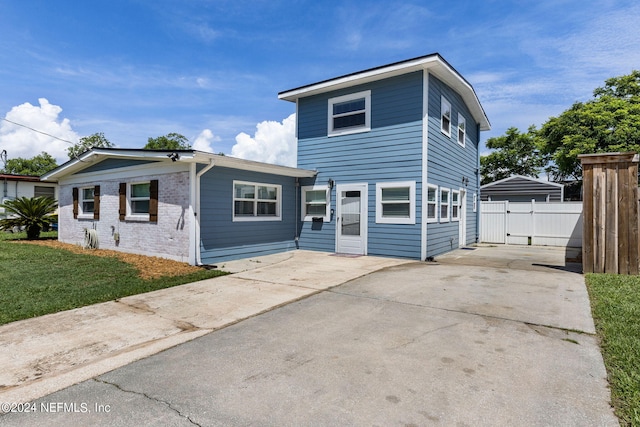 view of property featuring a front yard