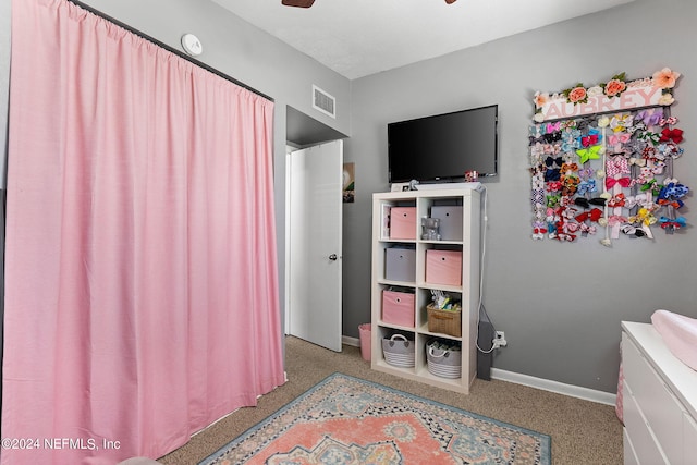 carpeted bedroom featuring ceiling fan