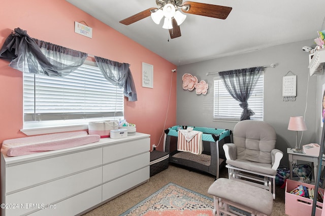 carpeted bedroom with vaulted ceiling and ceiling fan