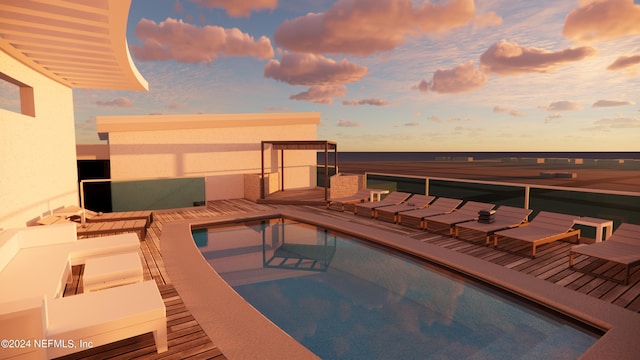 pool at dusk featuring an outdoor pool