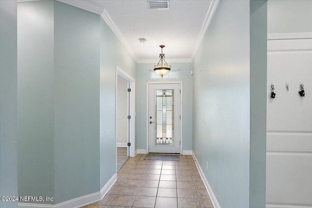 doorway to outside featuring crown molding, a textured ceiling, and light tile patterned floors