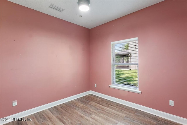 unfurnished room featuring light wood-type flooring